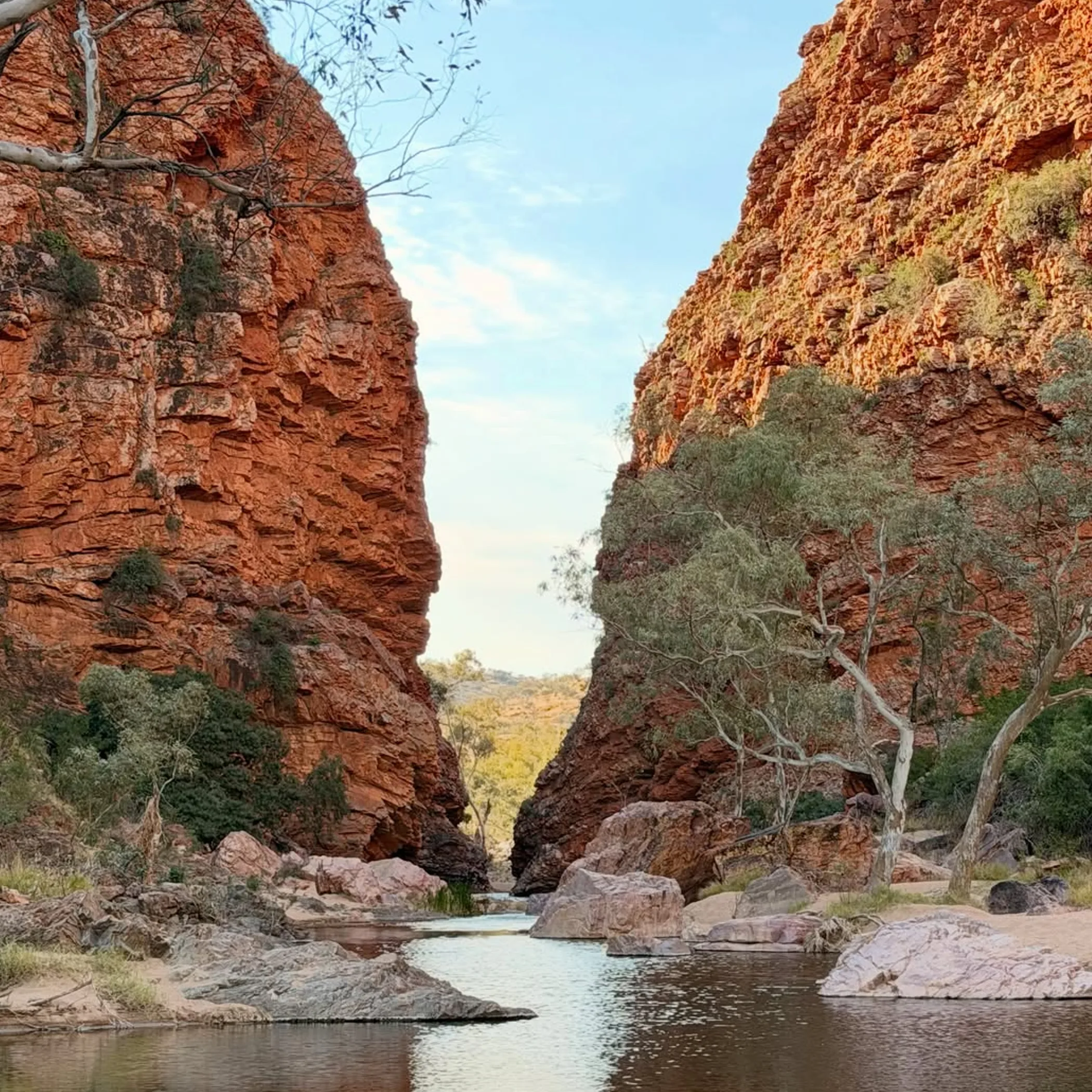 hikers walking uluru base trail autumn